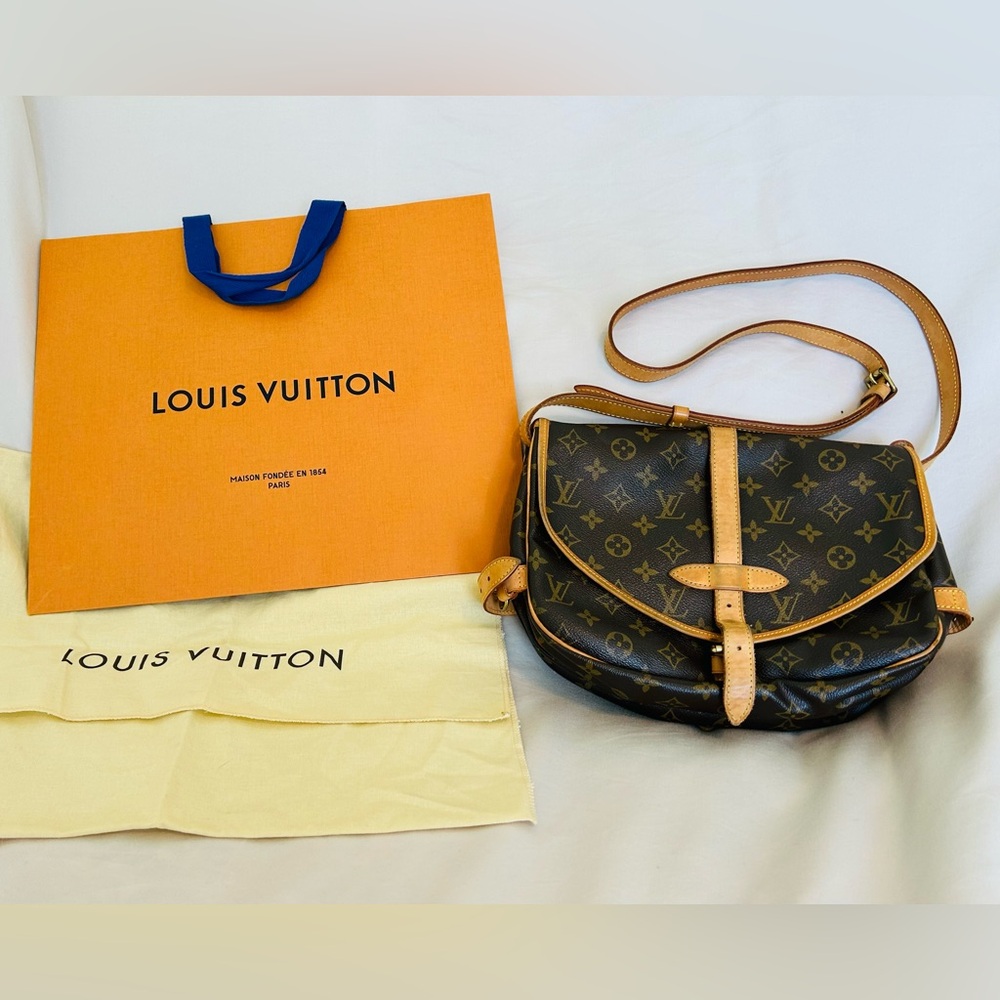 Louis Vuitton Saumur shoulder and cross body in brown Monogram.